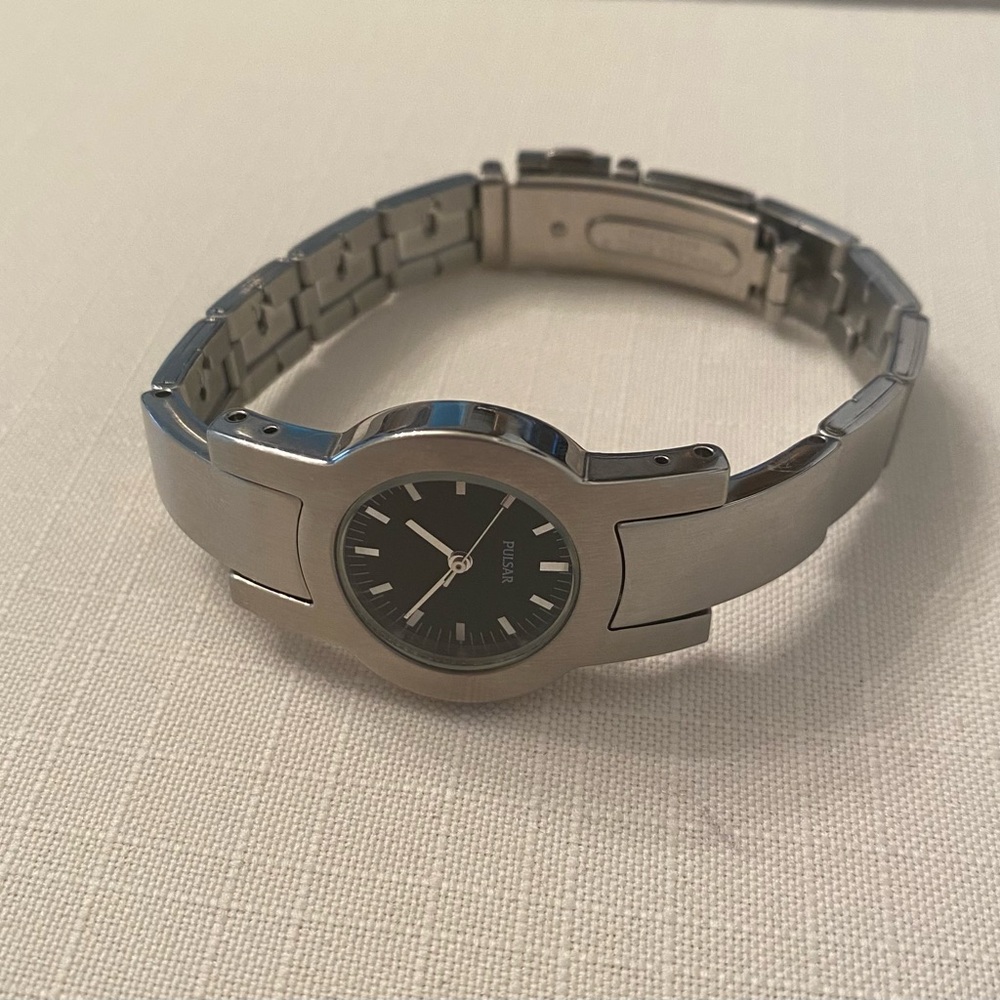 Vintage Stainless Steel Women’s Pulasr Watch With Black Face